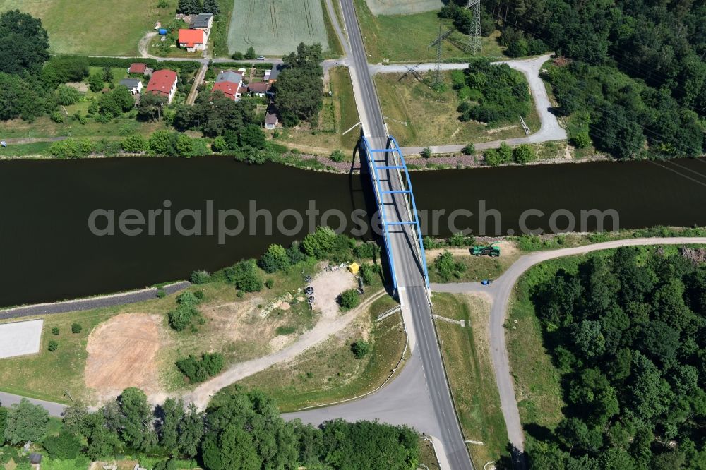 Wusterwitz from above - Strassenbruecke Wusterwitz Bridge across the Elbe-Havel-Canal in the North of Wusterwitz in the state of Brandenburg. The county road L96 takes its course across the blue steel arc bridge