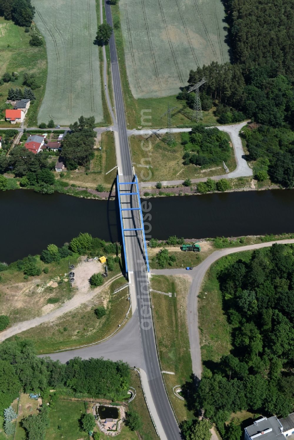 Wusterwitz from the bird's eye view: Strassenbruecke Wusterwitz Bridge across the Elbe-Havel-Canal in the North of Wusterwitz in the state of Brandenburg. The county road L96 takes its course across the blue steel arc bridge