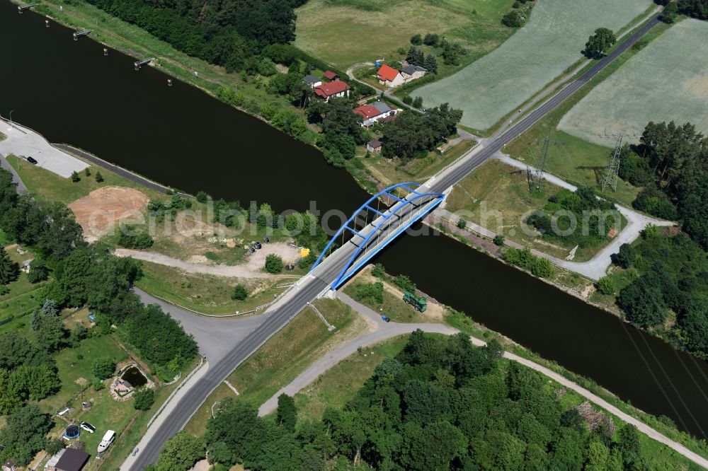 Wusterwitz from above - Strassenbruecke Wusterwitz Bridge across the Elbe-Havel-Canal in the North of Wusterwitz in the state of Brandenburg. The county road L96 takes its course across the blue steel arc bridge