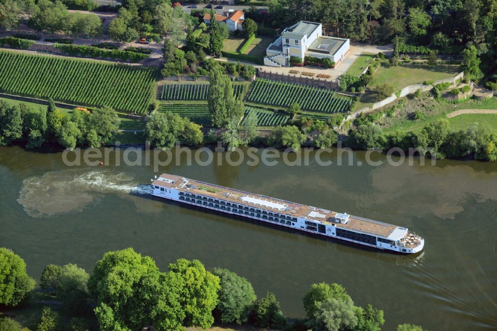 Aschaffenburg from above - River cruise ship on the river Main and Pompejanum in Aschaffenburg in the state of Bavaria. The ship belongs to Viking River Cruises and the Pompejanum is a copy of a Roman mansion