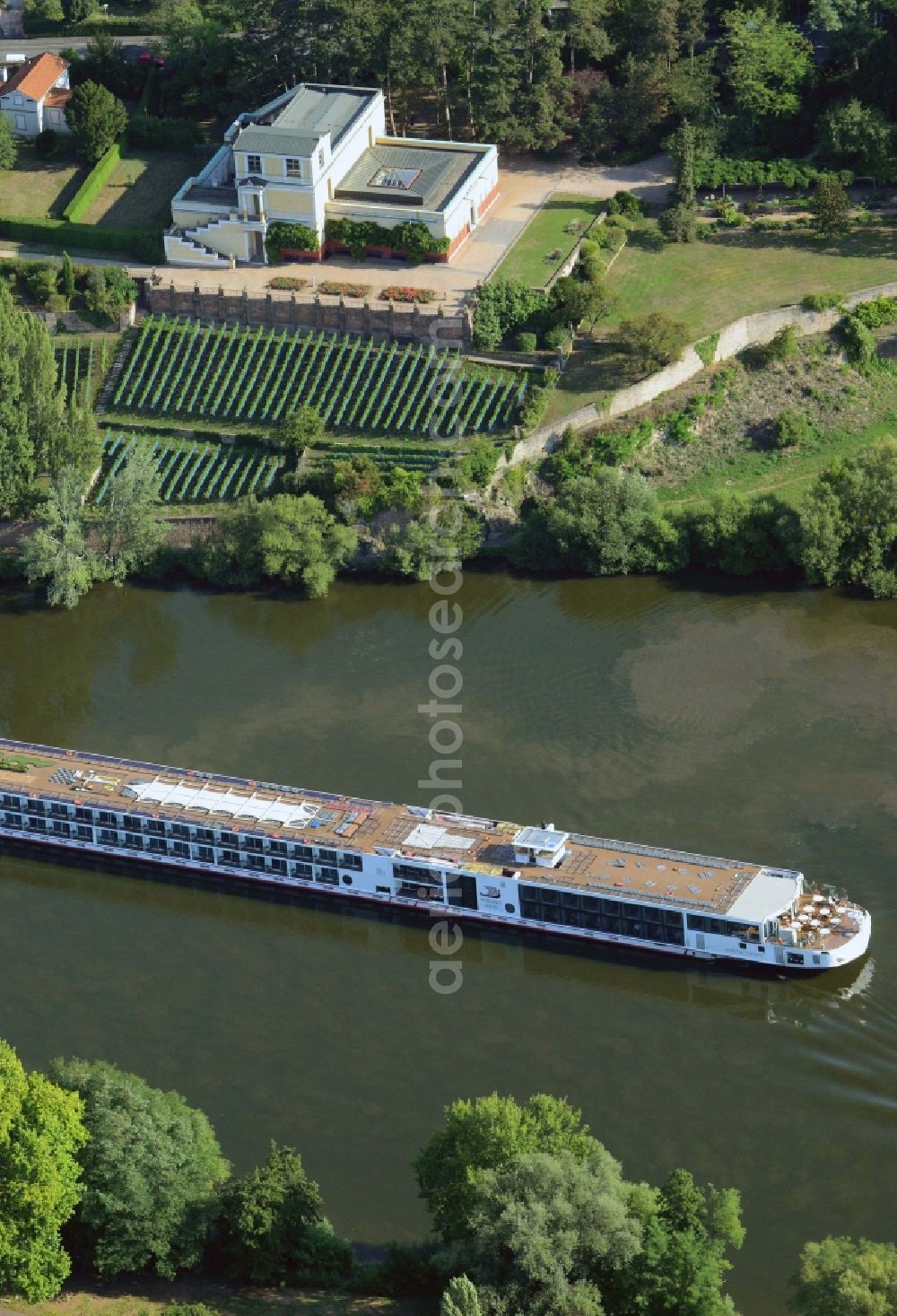 Aschaffenburg from the bird's eye view: River cruise ship on the river Main and Pompejanum in Aschaffenburg in the state of Bavaria. The ship belongs to Viking River Cruises and the Pompejanum is a copy of a Roman mansion