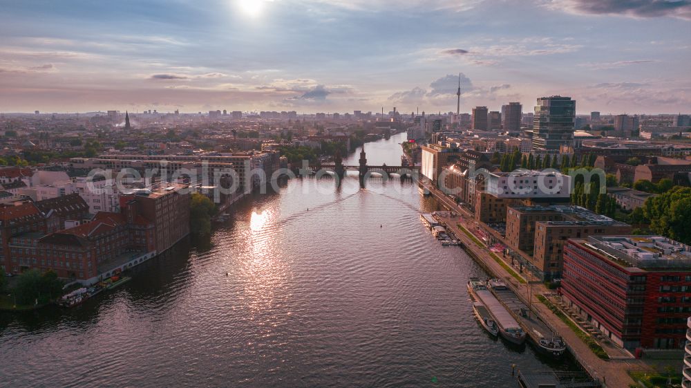 Aerial image Berlin - River - bridge construction Oberbaumbruecke for crossing the Spree in the district Friedrichshain in Berlin, Germany