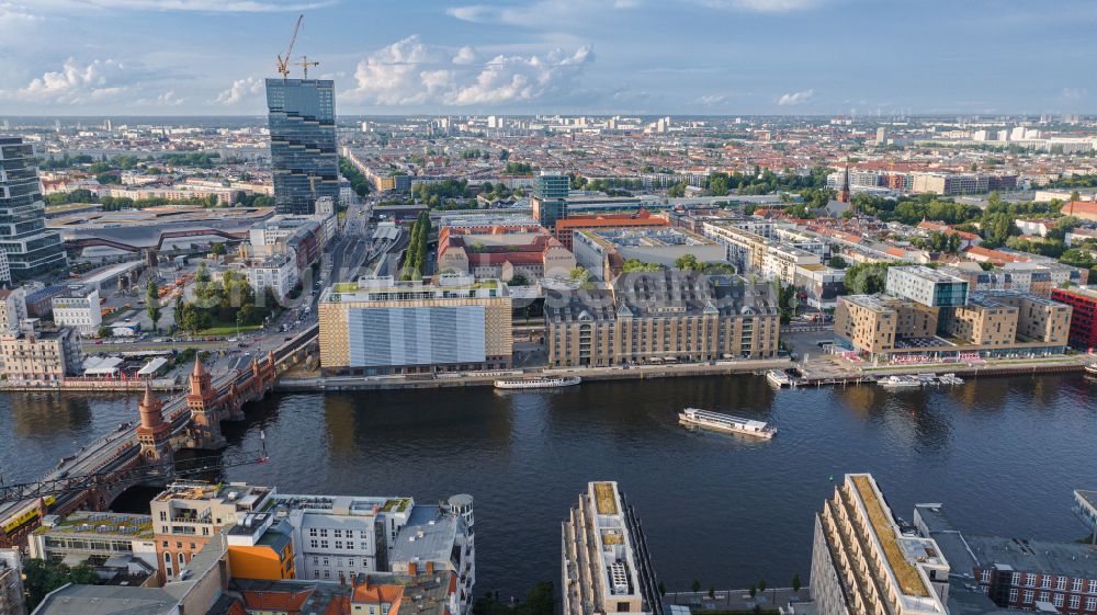 Aerial image Berlin - River - bridge construction Oberbaumbruecke for crossing the Spree in the district Friedrichshain in Berlin, Germany