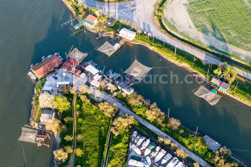 Porto Garibaldi from the bird's eye view: Fisher nets at the channel in Porto Garibaldi in Emilia-Romagna, Italy