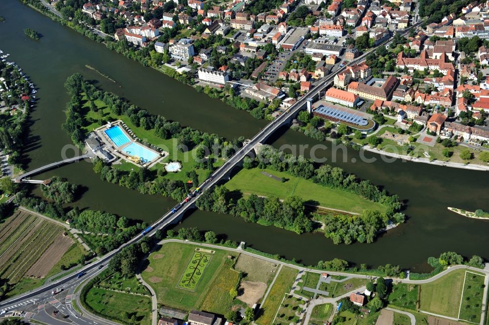 Kitzingen from above - View from east along the Main river with the Konrad-Adenauer-Bridge and the open-air bath on the Mondsee Island in Kitzingen in the state Bavaria