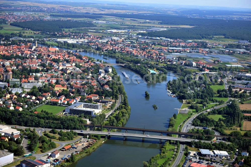 Kitzingen from above - View from south along the Main river with the South Bridge, Konrad-Adenauer-Bridge and the open-air bath on the Mondsee Island, Pipins Bridge, Old Main Bridge and North Bridge in Kitzingen in the state Bavaria