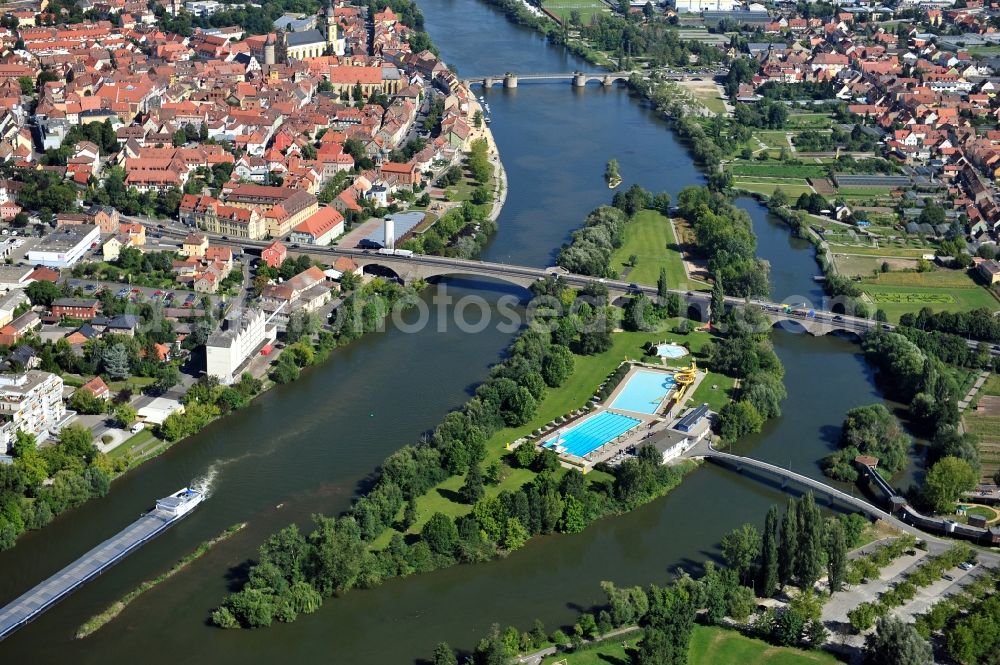 Kitzingen from above - View from south along the Main river with the Konrad-Adenauer-Bridge and the open-air bath on the Mondsee Island and Pipins Bridge, Old Main Bridge in Kitzingen in the state Bavaria