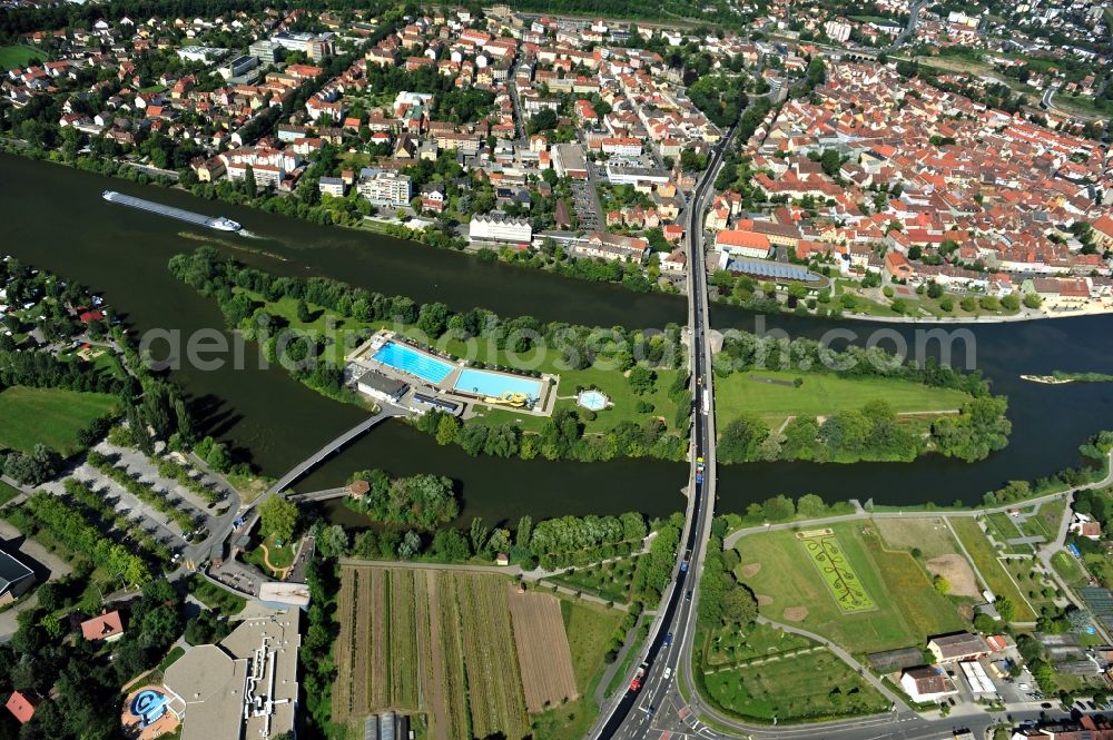 Kitzingen from above - View from east along the Main river with the Konrad-Adenauer-Bridge and the open-air bath on the Mondsee Island in Kitzingen in the state Bavaria