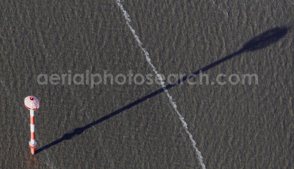 Nordenham from above - Course of the river Weser with long shadow of a seafaring symbol and warning mast in Nordenham in the state Lower Saxony