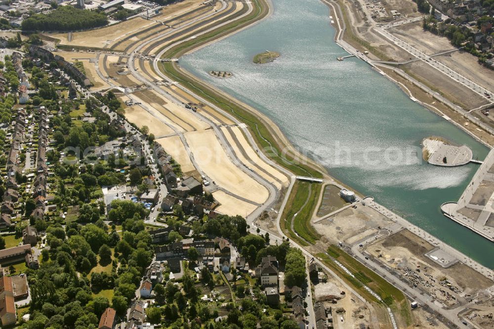 Dortmund Hörde from the bird's eye view: Aufnahme der Flutung der Phoenix-Sees im Stadtteil Hörde mit Fischaugenobjektiv. Auf dem ehemaligen Gelände der Hermannshütte soll ein 24 Hektar großer See mit einer Länge von 1.230 Metern und einer Breite von 310 Metern entstehen. The flooding of Lake Phoenix with fish-eye lens. On the former site of the ironworks Hermannhutte, a 24 hectares large lake will be formed.