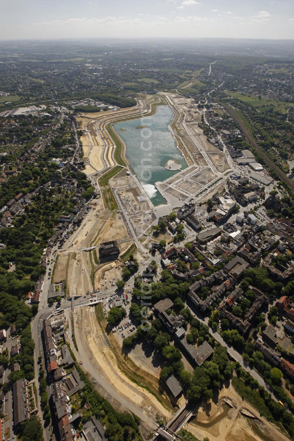 Dortmund Hörde from above - Aufnahme der Flutung der Phoenix-Sees im Stadtteil Hörde mit Fischaugenobjektiv. Auf dem ehemaligen Gelände der Hermannshütte soll ein 24 Hektar großer See mit einer Länge von 1.230 Metern und einer Breite von 310 Metern entstehen. The flooding of Lake Phoenix with fish-eye lens. On the former site of the ironworks Hermannhutte, a 24 hectares large lake will be formed.