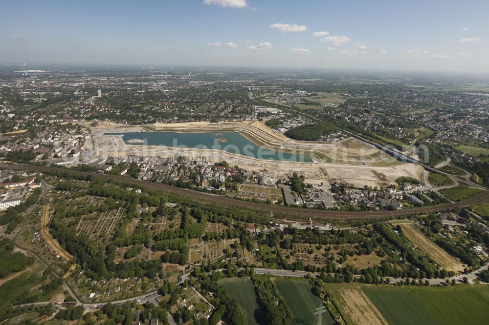 Aerial photograph Dortmund Hörde - Aufnahme der Flutung der Phoenix-Sees im Stadtteil Hörde mit Fischaugenobjektiv. Auf dem ehemaligen Gelände der Hermannshütte soll ein 24 Hektar großer See mit einer Länge von 1.230 Metern und einer Breite von 310 Metern entstehen. The flooding of Lake Phoenix with fish-eye lens. On the former site of the ironworks Hermannhutte, a 24 hectares large lake will be formed.