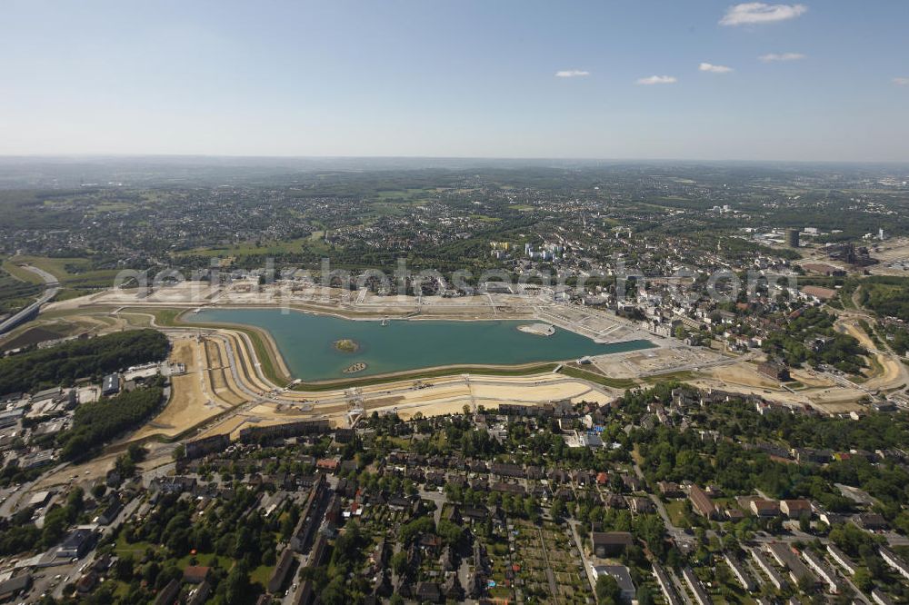 Dortmund Hörde from the bird's eye view: Aufnahme der Flutung der Phoenix-Sees im Stadtteil Hörde mit Fischaugenobjektiv. Auf dem ehemaligen Gelände der Hermannshütte soll ein 24 Hektar großer See mit einer Länge von 1.230 Metern und einer Breite von 310 Metern entstehen. The flooding of Lake Phoenix with fish-eye lens. On the former site of the ironworks Hermannhutte, a 24 hectares large lake will be formed.