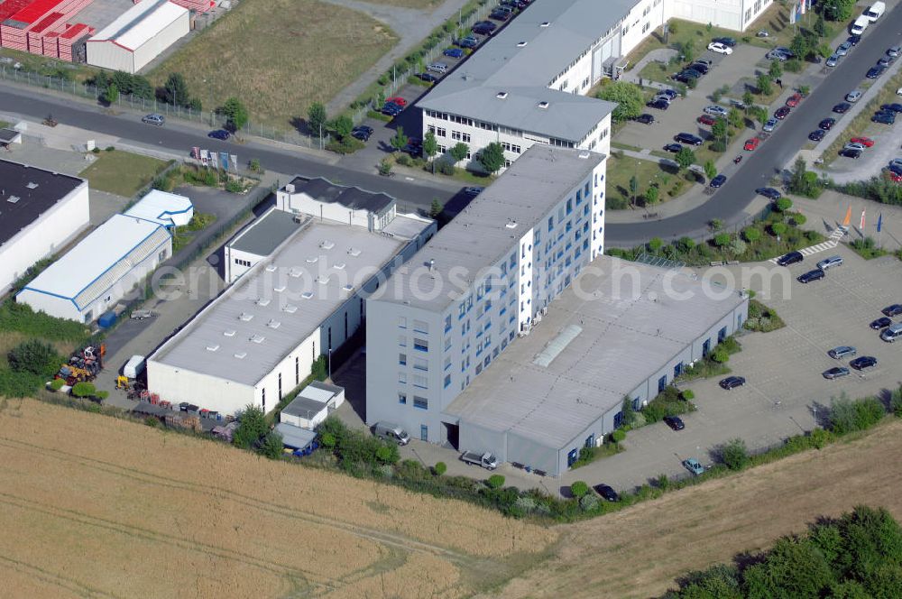 Köln from the bird's eye view: Ford Trainingszentrum Köln-Feldkassel im Gewerbegebiet Feldkassel. Das Gebäude hat eine Grundfläche von 1700qm und eine Kapazität von 72 Parkplätzen. Adresse: Oskar-Schindler-Straße 9, 50769 Köln-Feldkassel, Tel. +49(0)221 79100-100, Fax +49(0)221 79100-255 ; Vermietung / Verwaltung: Unternehmensgruppe Markus Gerold, An der Vaerstbrücke 1, 59425 Unna, Tel. +49(0)2303 25036-26, Fax +49(0)2303 25036-27, E-Mail: info@markus-gerold.de