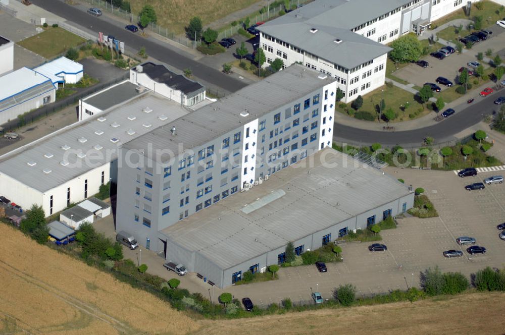 Aerial photograph Köln - Ford Trainingszentrum Köln-Feldkassel im Gewerbegebiet Feldkassel. Das Gebäude hat eine Grundfläche von 1700qm und eine Kapazität von 72 Parkplätzen. Adresse: Oskar-Schindler-Straße 9, 50769 Köln-Feldkassel, Tel. +49(0)221 79100-100, Fax +49(0)221 79100-255 ; Vermietung / Verwaltung: Unternehmensgruppe Markus Gerold, An der Vaerstbrücke 1, 59425 Unna, Tel. +49(0)2303 25036-26, Fax +49(0)2303 25036-27, E-Mail: info@markus-gerold.de