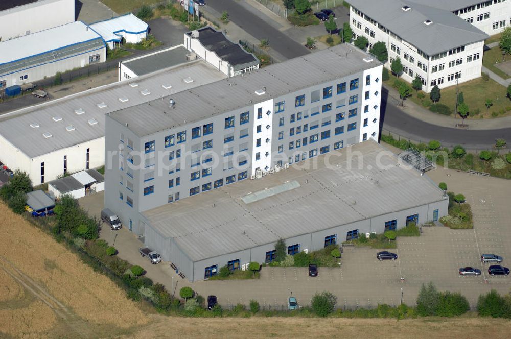 Köln from the bird's eye view: Ford Trainingszentrum Köln-Feldkassel im Gewerbegebiet Feldkassel. Das Gebäude hat eine Grundfläche von 1700qm und eine Kapazität von 72 Parkplätzen. Adresse: Oskar-Schindler-Straße 9, 50769 Köln-Feldkassel, Tel. +49(0)221 79100-100, Fax +49(0)221 79100-255 ; Vermietung / Verwaltung: Unternehmensgruppe Markus Gerold, An der Vaerstbrücke 1, 59425 Unna, Tel. +49(0)2303 25036-26, Fax +49(0)2303 25036-27, E-Mail: info@markus-gerold.de