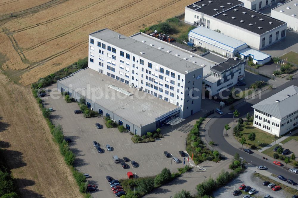 Aerial photograph Köln - Ford Trainingszentrum Köln-Feldkassel im Gewerbegebiet Feldkassel. Das Gebäude hat eine Grundfläche von 1700qm und eine Kapazität von 72 Parkplätzen. Adresse: Oskar-Schindler-Straße 9, 50769 Köln-Feldkassel, Tel. +49(0)221 79100-100, Fax +49(0)221 79100-255 ; Vermietung / Verwaltung: Unternehmensgruppe Markus Gerold, An der Vaerstbrücke 1, 59425 Unna, Tel. +49(0)2303 25036-26, Fax +49(0)2303 25036-27, E-Mail: info@markus-gerold.de