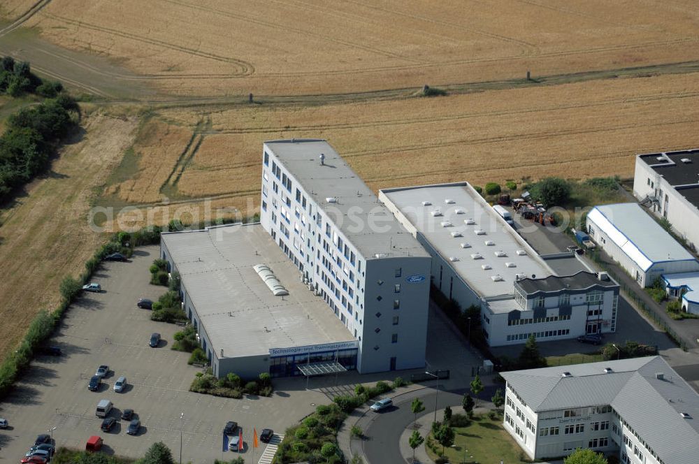 Aerial photograph Köln - Ford Trainingszentrum Köln-Feldkassel im Gewerbegebiet Feldkassel. Das Gebäude hat eine Grundfläche von 1700qm und eine Kapazität von 72 Parkplätzen. Adresse: Oskar-Schindler-Straße 9, 50769 Köln-Feldkassel, Tel. +49(0)221 79100-100, Fax +49(0)221 79100-255 ; Vermietung / Verwaltung: Unternehmensgruppe Markus Gerold, An der Vaerstbrücke 1, 59425 Unna, Tel. +49(0)2303 25036-26, Fax +49(0)2303 25036-27, E-Mail: info@markus-gerold.de