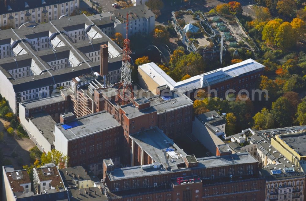 Aerial image Berlin - Research building and office complex of the Deutsche Telekom innovation Laboratories (t rennet) with former Telekom Broadcasting tower and dwelling houses in the background in Berlin, Germany