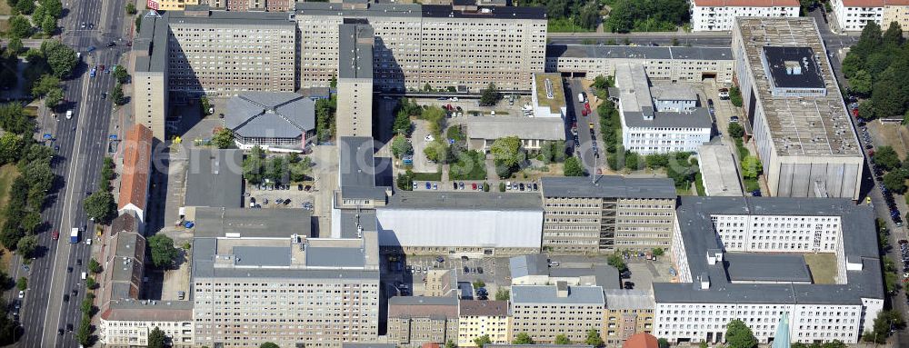 Berlin from above - Blick auf die Forschungs- und Gedenkstätte Normannenstraße / Ruschestrasse, der ehemaligen Zentrale des Ministeriums für Staatssicherheit ( MfS ). Sie ist eine Forschungs- und Gedenkstätte zum politischen System der DDR. Die Ausstellung umfasst die Amts- und Arbeitsräume des ehemaligen Ministers für Staatssicherheit Erich Mielke. Träger ist der Verein Antistalinistische Aktion Berlin-Normannenstraße e. V. (ASTAK), die im Sommer 1990 von Bürgerrechtlern in Berlin gegründet wurde. Ihr Ziel ist die Förderung des Aufbaus der Gedenkstätte als Zentrum zur Sammlung, Bewahrung, Dokumentation, Aufarbeitung und Ausstellung von Sachzeugnissen sowie themenbezogener Forschungsarbeit zur DDR. View of the former headquarters of the Ministry for State Security (Stasi) of the GDR.