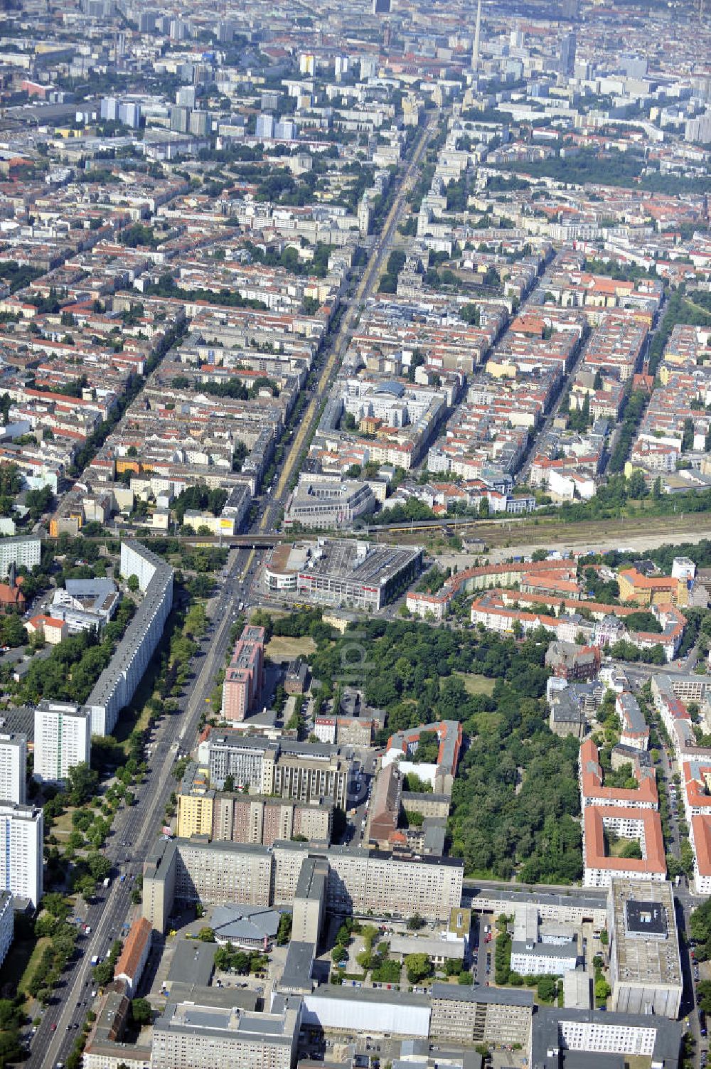 Aerial image Berlin - Blick auf die Forschungs- und Gedenkstätte Normannenstraße / Ruschestrasse, der ehemaligen Zentrale des Ministeriums für Staatssicherheit ( MfS ). Sie ist eine Forschungs- und Gedenkstätte zum politischen System der DDR. Die Ausstellung umfasst die Amts- und Arbeitsräume des ehemaligen Ministers für Staatssicherheit Erich Mielke. Träger ist der Verein Antistalinistische Aktion Berlin-Normannenstraße e. V. (ASTAK), die im Sommer 1990 von Bürgerrechtlern in Berlin gegründet wurde. Ihr Ziel ist die Förderung des Aufbaus der Gedenkstätte als Zentrum zur Sammlung, Bewahrung, Dokumentation, Aufarbeitung und Ausstellung von Sachzeugnissen sowie themenbezogener Forschungsarbeit zur DDR. View of the former headquarters of the Ministry for State Security (Stasi) of the GDR.