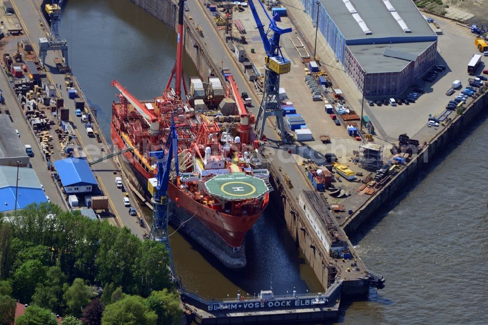 Aerial photograph Hamburg - View of overhaul and maintenance work on the research vessel Petrojarl Banff in dry dock of Blohm and Voss Dock Elbe in Hamburg. The dry dock Elbe 17 is one of the largest dry dock in Europe. It is located on the grounds of the Blohm + Voss shipyard in Hamburg harbor