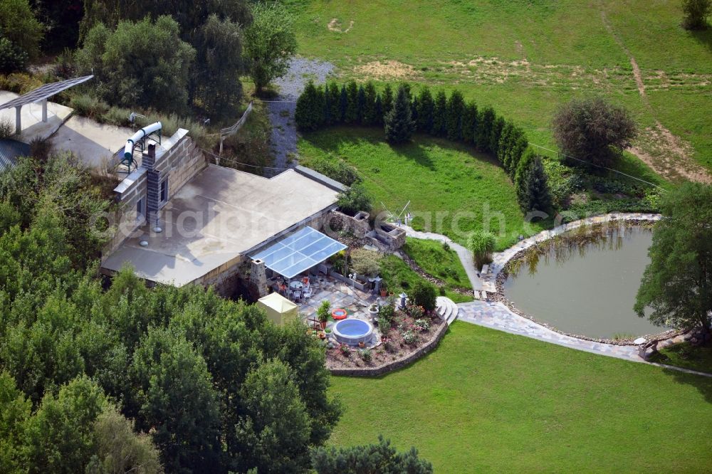 Werneuchen from above - View at for recreation and leisure converted former airplane shelter at the airfield in Werneuchen in the federal state of Brandenburg