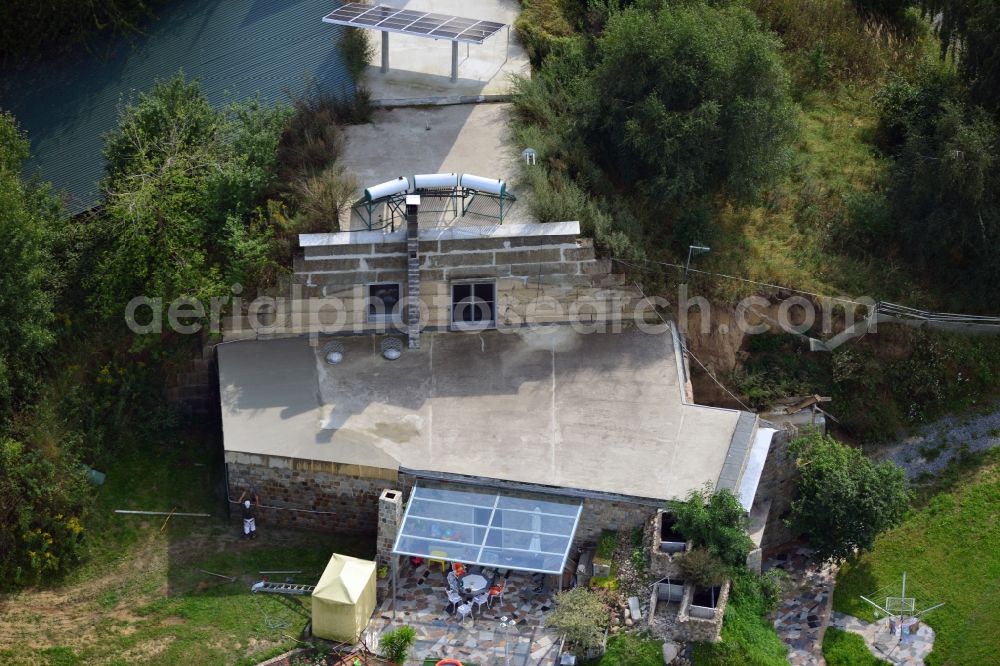 Werneuchen from the bird's eye view: View at for recreation and leisure converted former airplane shelter at the airfield in Werneuchen in the federal state of Brandenburg