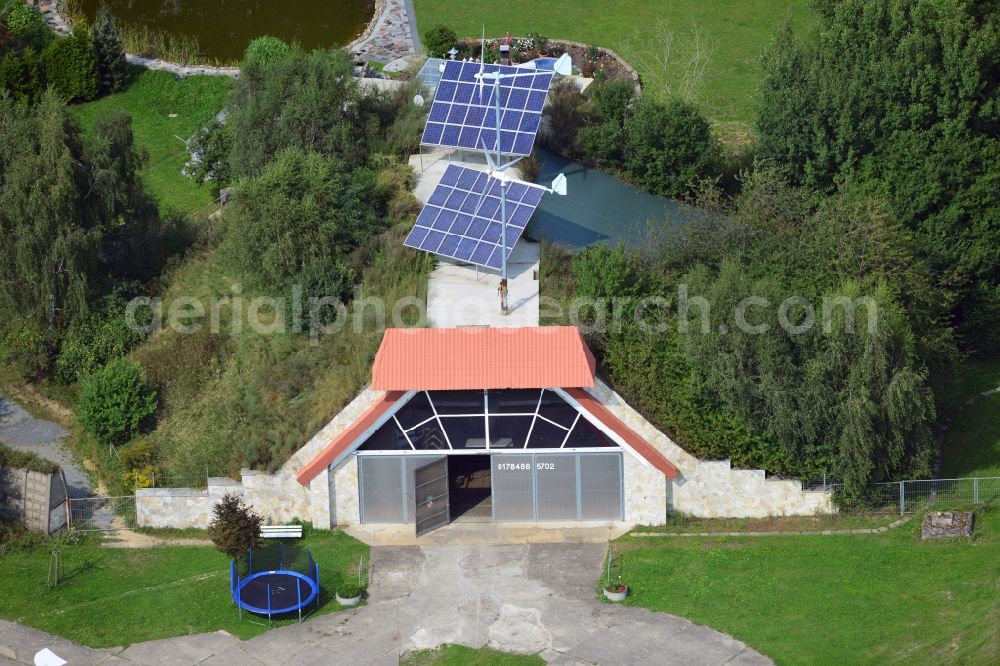 Werneuchen from above - View at for recreation and leisure converted former airplane shelter at the airfield in Werneuchen in the federal state of Brandenburg