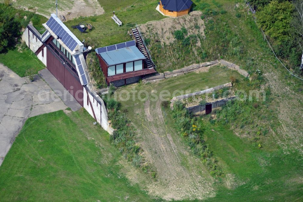 Werneuchen from the bird's eye view: View at for recreation and leisure converted former airplane shelter at the airfield in Werneuchen in the federal state of Brandenburg