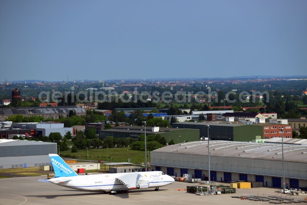 Schkeuditz from the bird's eye view: Cargo aircraft Antonov AN-124 Volga Dnepr cargo airline - charter company on the terminal at the airport in Schkeuditz in Saxony