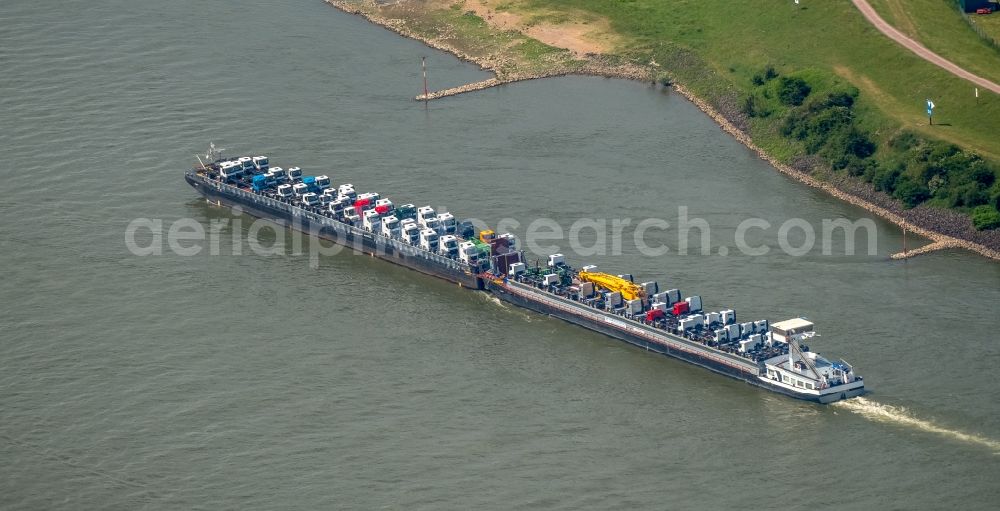 Duisburg from the bird's eye view: Cargo ship on the inland shipping waterway of the river course of the Rhine river in Duisburg in the state North Rhine-Westphalia, Germany