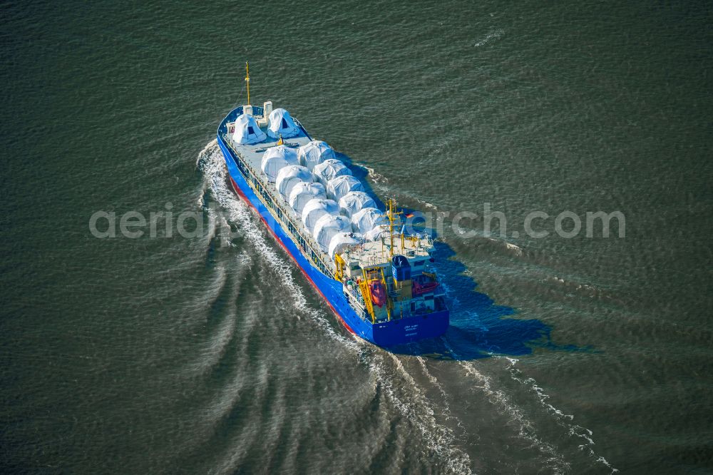 Bremerhaven from above - Cargo ship JSP Moen - with wind power engines on the deck on the inland waterway of the Weser river in Bremerhaven in the state Bremen, Germany