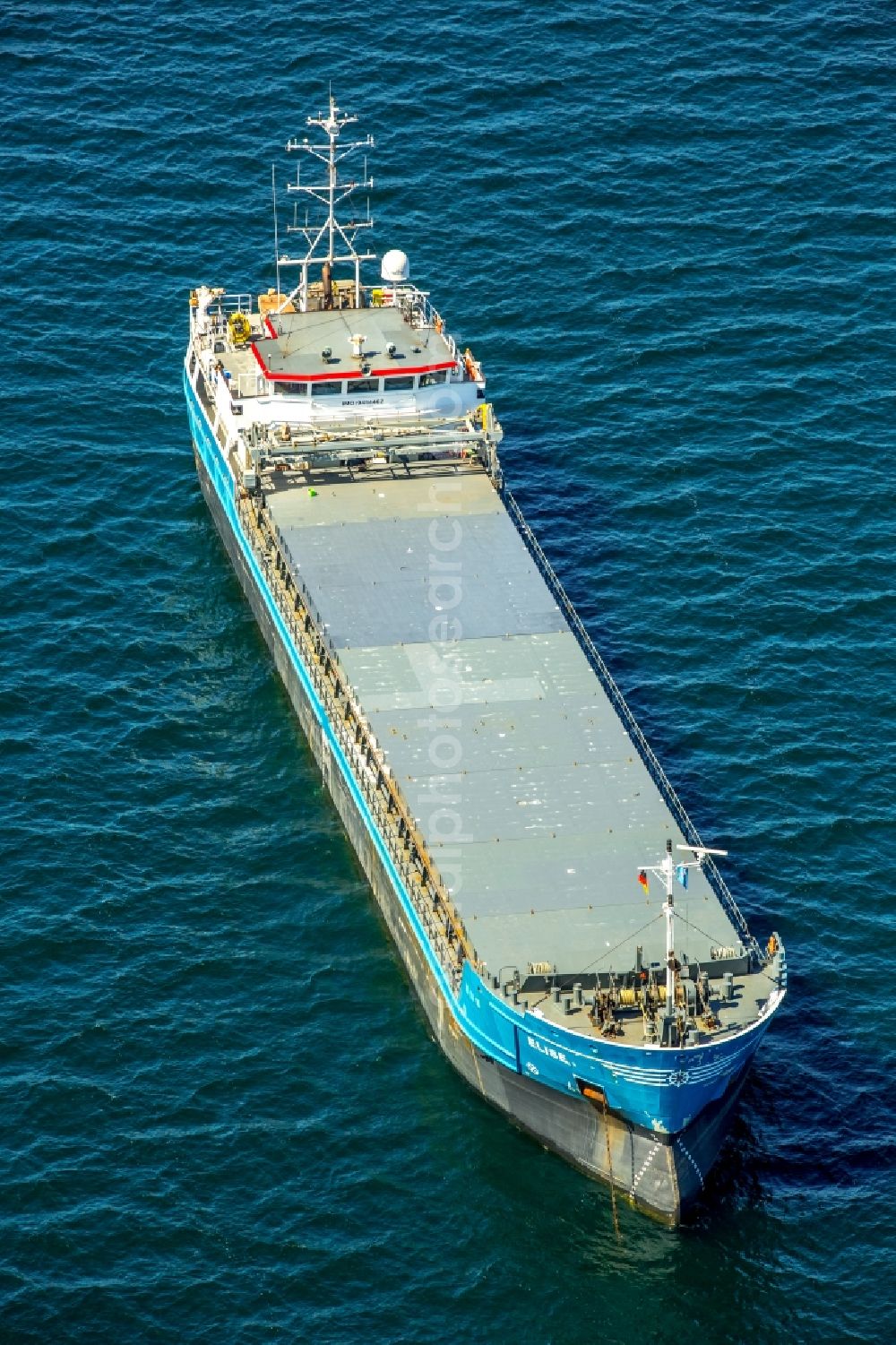 Dassow from above - Cargo ships and bulk carriers ELISE (IMO: 9454462 MMSI: 305 170 000) in driving on the water surface of the Baltic Sea in Dassow in Mecklenburg - West Pomerania