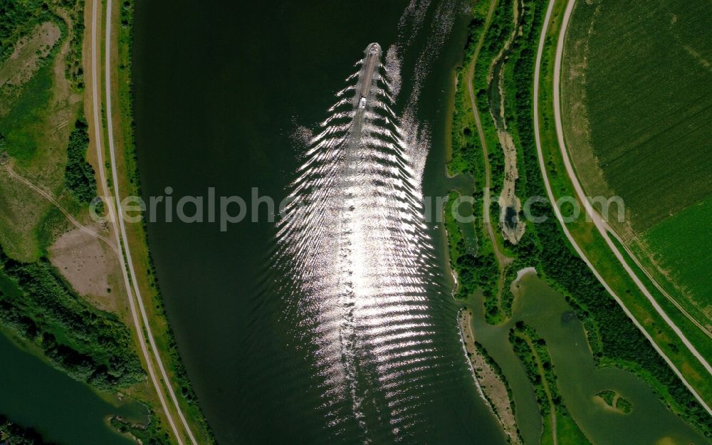 Aerial image Aholfing - Cargo ships and bulk carriers with fan-shaped wave reflection on the inland shipping waterway of the river course of the river Danube in Aholfing in the state Bavaria, Germany