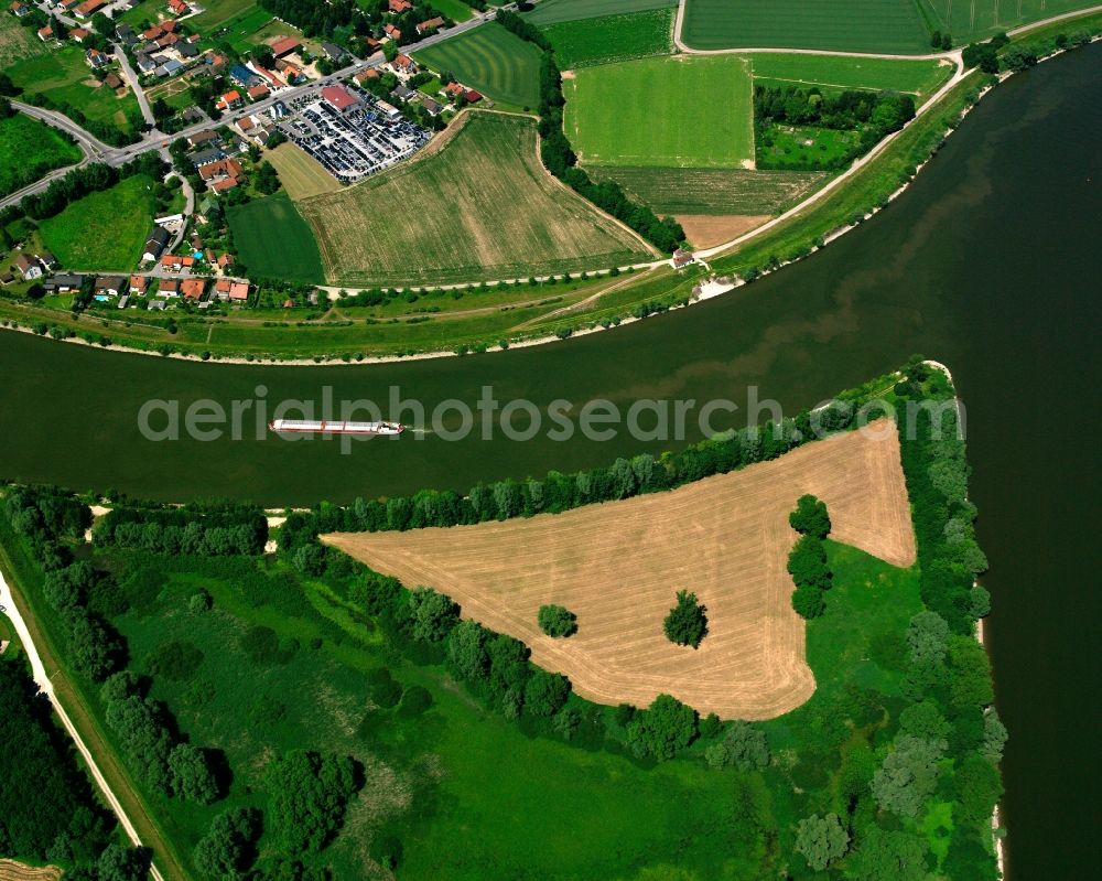 Aerial image Unterhartenberg - Cargo ships and bulk carriers on the inland shipping waterway of the river course of the river Danube in Unterhartenberg in the state Bavaria, Germany