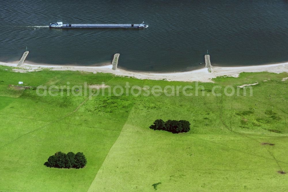 Duisburg from above - Cargo ships and bulk carriers on the inland shipping waterway of the river course of the Rhine river in Duisburg in the state North Rhine-Westphalia, Germany