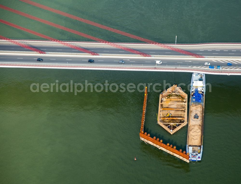 Aerial image Wesel - Cargo ships and bulk carriers on the inland shipping waterway at the construction site near the new bridge of the Rhine in Wesel in the state North Rhine-Westphalia