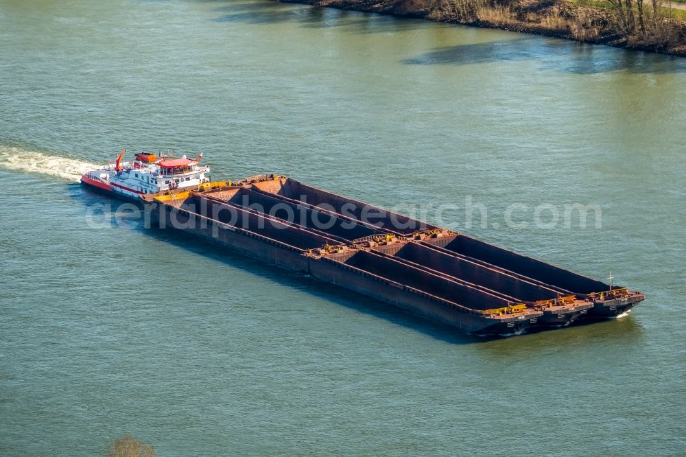 Aerial photograph Xanten - Cargo ships and bulk carriers on the inland shipping waterway of the river course of the Rhine river in Xanten in the state North Rhine-Westphalia, Germany