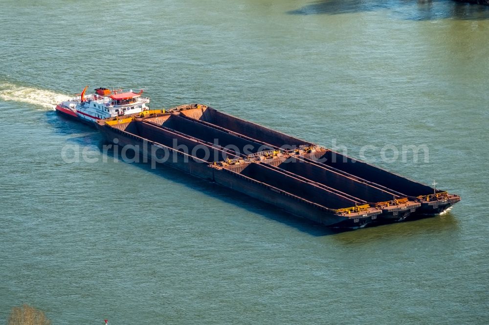 Xanten from above - Cargo ships and bulk carriers on the inland shipping waterway of the river course of the Rhine river in Xanten in the state North Rhine-Westphalia, Germany