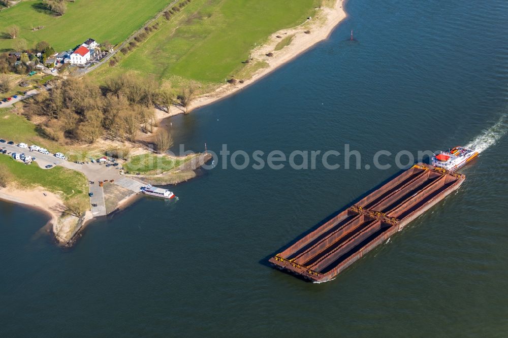 Aerial image Xanten - Cargo ships and bulk carriers on the inland shipping waterway of the river course of the Rhine river in Xanten in the state North Rhine-Westphalia, Germany