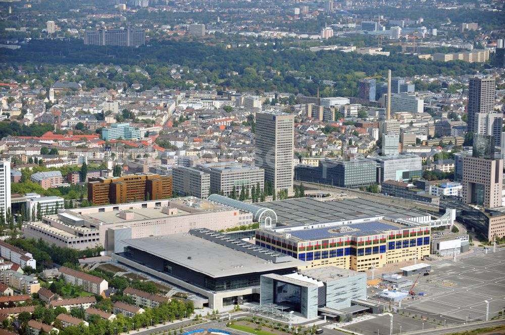 Frankfurt am Main from the bird's eye view: Blick auf das Areal am Frankfurter Messegelände mit dem Neubau der Halle 3 und dem Messeturm, einem bekannten Büro-und Geschäftsgebäude. View of the area at the Frankfurt fair grounds with the new Hall 3 and the Exhibition Tower, a prominent office and retail buildings.