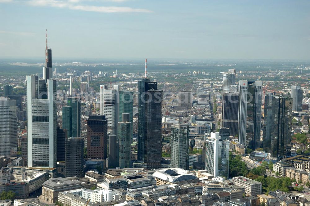 Frankfurt am Main from above - Blick auf die Frankfurter Skyline am Main. Das Frankfurter Banken-, und Bürohauszentrum reiht die Mainmetropole in die Liste typische europäischer Hochhausstädte ein. View of the Frankfurt am Main skyline. The Frankfurt banking, and office center joins a list of the main metropolis in the typical high-rise European citys.