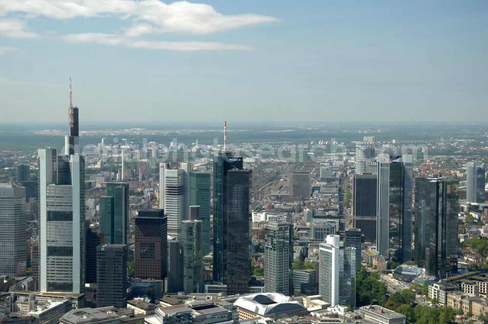 Frankfurt am Main from the bird's eye view: Blick auf die Frankfurter Skyline am Main. Das Frankfurter Banken-, und Bürohauszentrum reiht die Mainmetropole in die Liste typische europäischer Hochhausstädte ein. View of the Frankfurt am Main skyline. The Frankfurt banking, and office center joins a list of the main metropolis in the typical high-rise European citys.