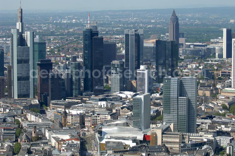 Frankfurt am Main from above - Blick auf die Frankfurter Skyline am Main. Das Frankfurter Banken-, und Bürohauszentrum reiht die Mainmetropole in die Liste typische europäischer Hochhausstädte ein. View of the Frankfurt am Main skyline. The Frankfurt banking, and office center joins a list of the main metropolis in the typical high-rise European citys.