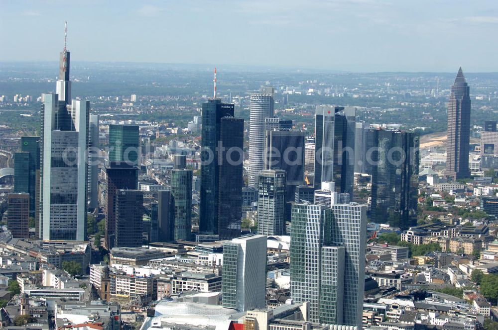 Frankfurt am Main from the bird's eye view: Blick auf die Frankfurter Skyline am Main. Das Frankfurter Banken-, und Bürohauszentrum reiht die Mainmetropole in die Liste typische europäischer Hochhausstädte ein. View of the Frankfurt am Main skyline. The Frankfurt banking, and office center joins a list of the main metropolis in the typical high-rise European citys.