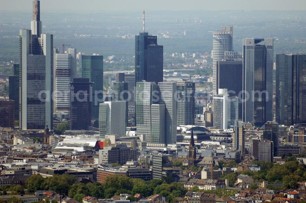 Frankfurt am Main from above - Blick auf die Frankfurter Skyline am Main. Das Frankfurter Banken-, und Bürohauszentrum reiht die Mainmetropole in die Liste typische europäischer Hochhausstädte ein. View of the Frankfurt am Main skyline. The Frankfurt banking, and office center joins a list of the main metropolis in the typical high-rise European citys.