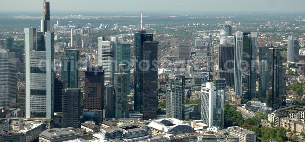 Frankfurt am Main from above - Blick auf die Frankfurter Skyline am Main. Das Frankfurter Banken-, und Bürohauszentrum reiht die Mainmetropole in die Liste typische europäischer Hochhausstädte ein. View of the Frankfurt am Main skyline. The Frankfurt banking, and office center joins a list of the main metropolis in the typical high-rise European citys.