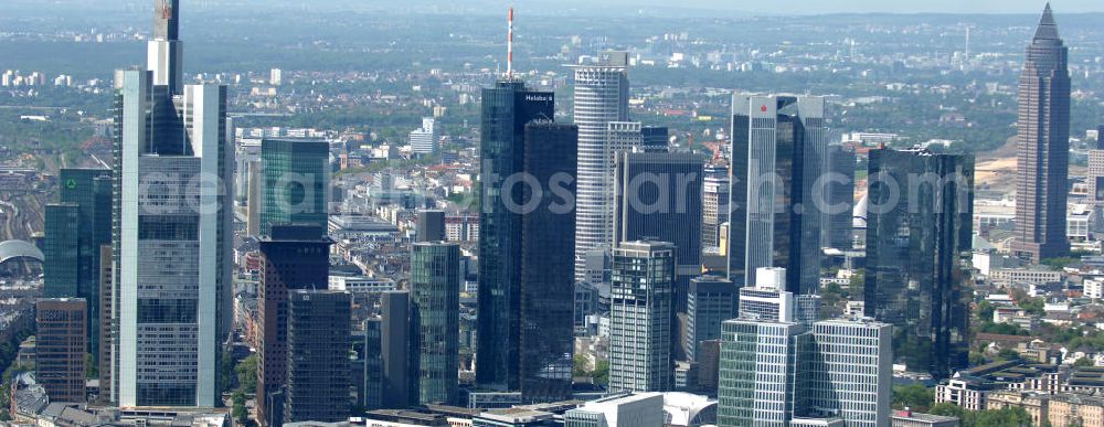 Frankfurt am Main from the bird's eye view: Blick auf die Frankfurter Skyline am Main. Das Frankfurter Banken-, und Bürohauszentrum reiht die Mainmetropole in die Liste typische europäischer Hochhausstädte ein. View of the Frankfurt am Main skyline. The Frankfurt banking, and office center joins a list of the main metropolis in the typical high-rise European citys.