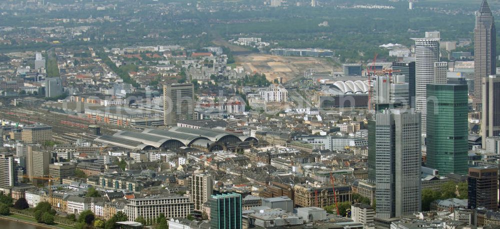 Frankfurt am Main from above - Blick auf die Frankfurter Skyline am Main. Das Frankfurter Banken-, und Bürohauszentrum reiht die Mainmetropole in die Liste typische europäischer Hochhausstädte ein. View of the Frankfurt am Main skyline. The Frankfurt banking, and office center joins a list of the main metropolis in the typical high-rise European citys.